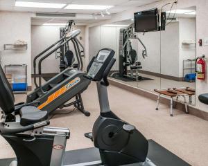 a gym with a treadmill and a flat screen tv at Quality Inn Navajo Nation Capital in Window Rock