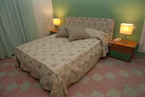 Postel nebo postele na pokoji v ubytování Hotel Venere