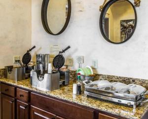 
a kitchen with a sink and a counter top at Rodeway Inn & Suites Williams Downtowner-Rte 66 in Williams
