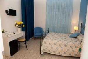 Postel nebo postele na pokoji v ubytování Hotel Venere