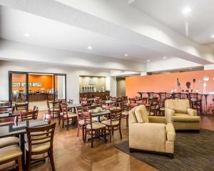 a living room filled with chairs and tables at Sleep Inn & Suites Page at Lake Powell in Page