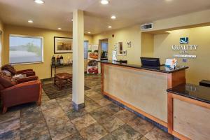 a lobby of a quality inn with a reception desk at Quality Inn Parker in Parker