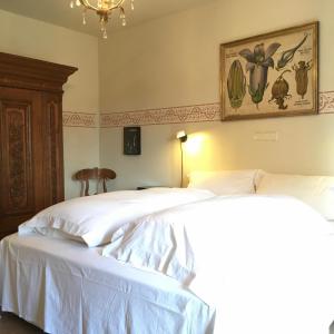 מיטה או מיטות בחדר ב-Villa zur Erholung Bed & Breakfast