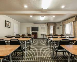 a classroom with tables and chairs and a flat screen tv at Quality Inn Temecula Valley Wine Country in Temecula