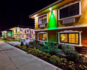 a building with a green light on the side of it at Quality Inn Hayward in Hayward