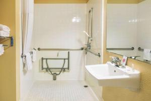 a bathroom with a shower, sink, and tub at Comfort Inn & Suites San Francisco Airport North in South San Francisco