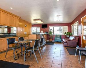 a kitchen with a table and chairs in a room at Rodeway Inn Fallbrook Downtown in Fallbrook