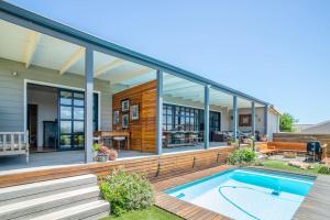 a house with a swimming pool in front of it at 29 Earlibelle in Stellenbosch