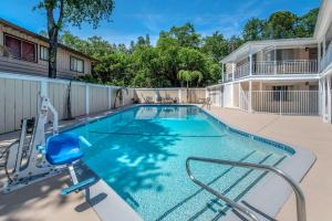 a swimming pool in the courtyard of a apartment building at Abode in Redding