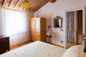 Postel nebo postele na pokoji v ubytování Villa Nichesola
