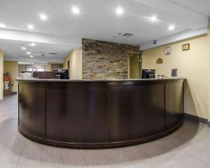 a large lobby with a large bar in the middle at Courtyard by Marriott Regina Downtown in Regina