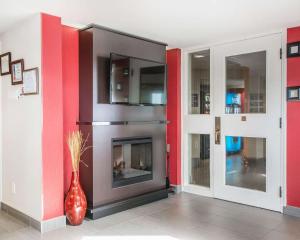 a kitchen with a stove, oven, and refrigerator at Comfort Inn Edmundston in Edmundston