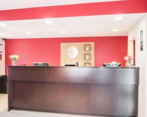 a kitchen with a red counter top and a white counter top at Comfort Inn Fredericton in Fredericton