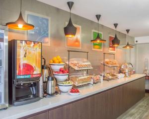 a buffet line with food on display in a restaurant at Comfort Inn Burlington in Burlington