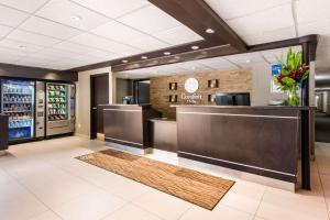 a lobby of a coffee shop with a counter at Comfort Inn Airport West in Mississauga