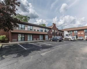 a parking lot in front of a brick building at Comfort Inn Drummondville in Drummondville