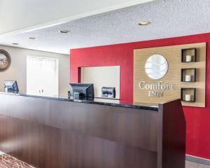 a lobby with a counter with a sign that reads comfort inn at Comfort Inn Thetford Mines in Thetford Mines