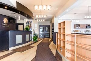 a lobby of a restaurant with a counter at Comfort Inn & Suites in Saint-Jérôme