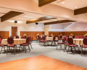 a conference room with a long table and chairs at Hotel Danube Bleu in Forestville +23 photos