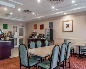 a conference room with a table and chairs at Comfort Inn Mississauga in Mississauga