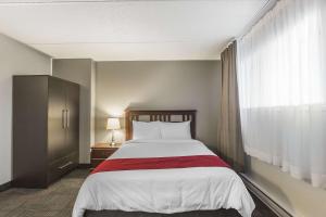 Postel nebo postele na pokoji v ubytování Hôtel Le Principal