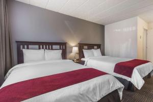 Postel nebo postele na pokoji v ubytování Hôtel Le Principal