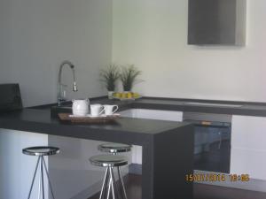 Kuchyň nebo kuchyňský kout v ubytování Amplia casa con piscina cerca playa