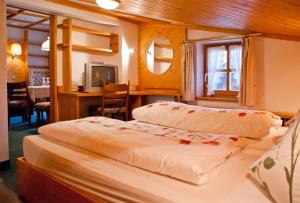 En eller flere senger på et rom på Hotel-Gasthof "Zur Mühle"