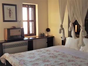 Кровать или кровати в номере Rathimata Villas
