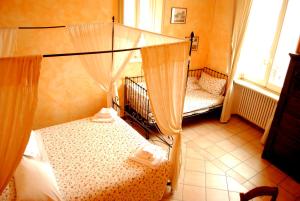 Postel nebo postele na pokoji v ubytování B&B MilleQuattrocento