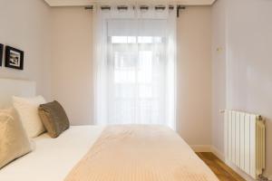 Łóżko lub łóżka w pokoju w obiekcie Sausalito - Iberorent Apartments