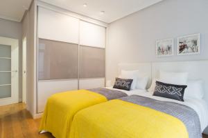 Łóżko lub łóżka w pokoju w obiekcie Sausalito - Iberorent Apartments