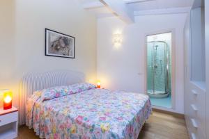 A bed or beds in a room at Appartamenti Lungomare Seafront - Goelba