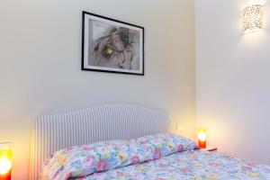 A bed or beds in a room at Appartamenti Lungomare Seafront - Goelba