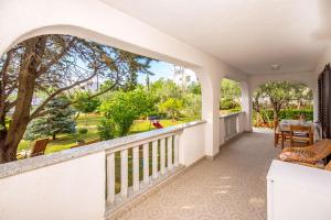 a balcony with a view of a park at Garden paradise App in Sveti Vid-Miholjice