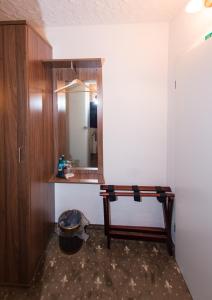 a bathroom with a sink and a mirror at Hotel und Restaurant Löwenbräu Köln in Cologne