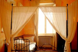 Postel nebo postele na pokoji v ubytování B&B MilleQuattrocento