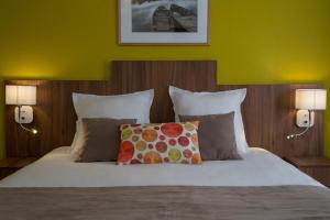Postel nebo postele na pokoji v ubytování Logis Hôtel Chaptal, Amboise