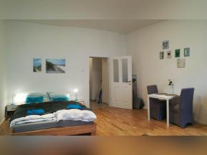 Posteľ alebo postele v izbe v ubytovaní Lovely Studio Apartment Volkertmarkt