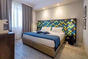 Postel nebo postele na pokoji v ubytování Best Western Hotel Cristallo