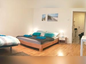 Posteľ alebo postele v izbe v ubytovaní Lovely Studio Apartment Volkertmarkt