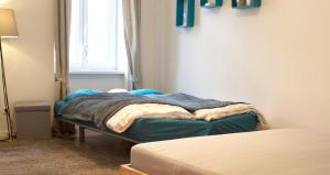 Posteľ alebo postele v izbe v ubytovaní Lovely Studio Apartment Volkertmarkt