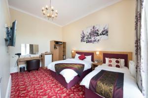 Postel nebo postele na pokoji v ubytování Edgerton Hotel + 37 fotografií