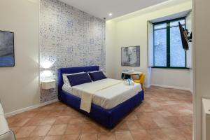A bed or beds in a room at Mythos Holidays