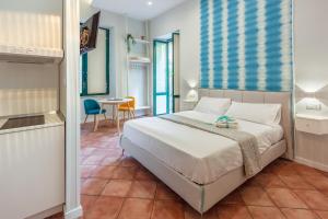 A bed or beds in a room at Mythos Holidays