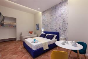 A bed or beds in a room at Mythos Holidays