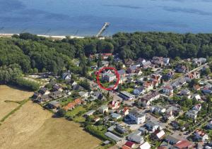 an aerial view of a house with a red circle at Villa Maria Wohnung 08 in Ostseebad Koserow