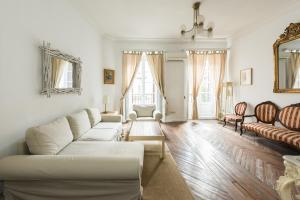 a living room with a couch and a table at Apartamentos Madrid Centro W in Madrid