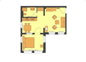 a floor plan of a house with furniture at Villa Maria Wohnung 06 in Ostseebad Koserow