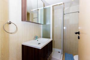 a bathroom with a sink and a shower at Kama Lifestyle Apartments in Protaras